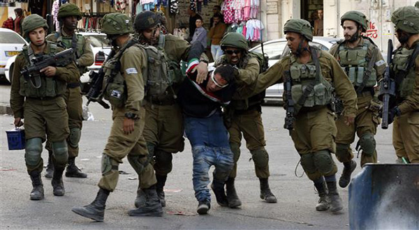 "Israeli" troops abusing Palestinian youth